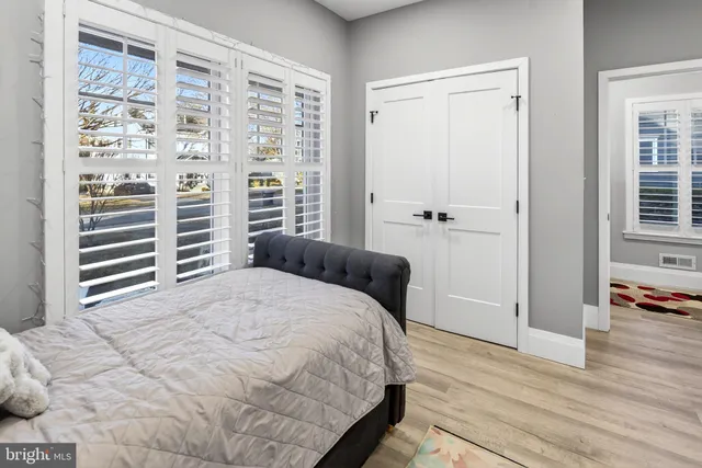 a bathroom with a granite countertop toilet sink and shower