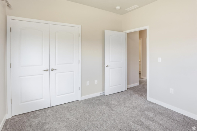1838 West 300th Street South, Unit B Mapleton, UT 84664 - Photo 24 of 51 Gray textured carpeting provides comfort in this room featuring neutral wall tones