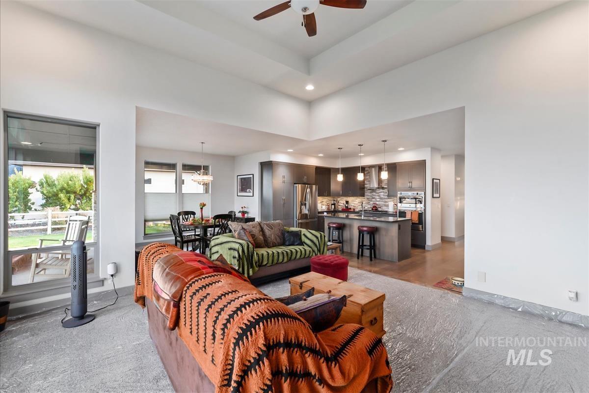 24398 Tombstone Ridge Court Middleton, ID 83644 - Photo 15 of 48 Open-concept living area with vaulted ceilings and recessed lighting