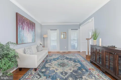 a spacious bedroom with a bed and a ceiling fan