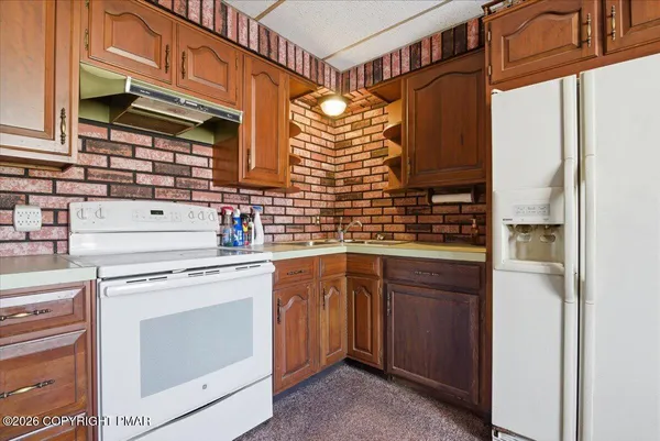 a bathroom with a sink a toilet and vanity