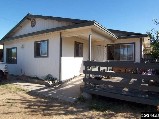 a front view of a house with boat