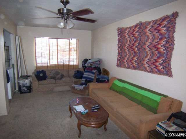 1620 Trainer Way Reno, NV 89512 - Photo 4 of 9 a living room with furniture and a chandelier