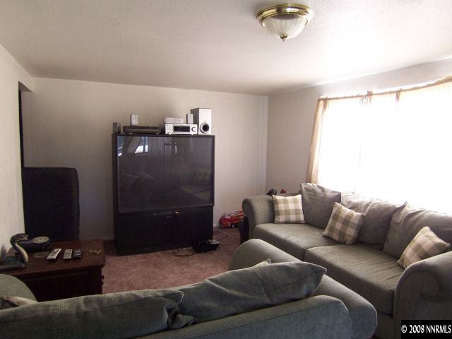 1620 Trainer Way Reno, NV 89512 - Photo 5 of 9 a living room with furniture and a air conditioner vent