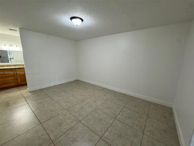 an empty room with a empty space and a window