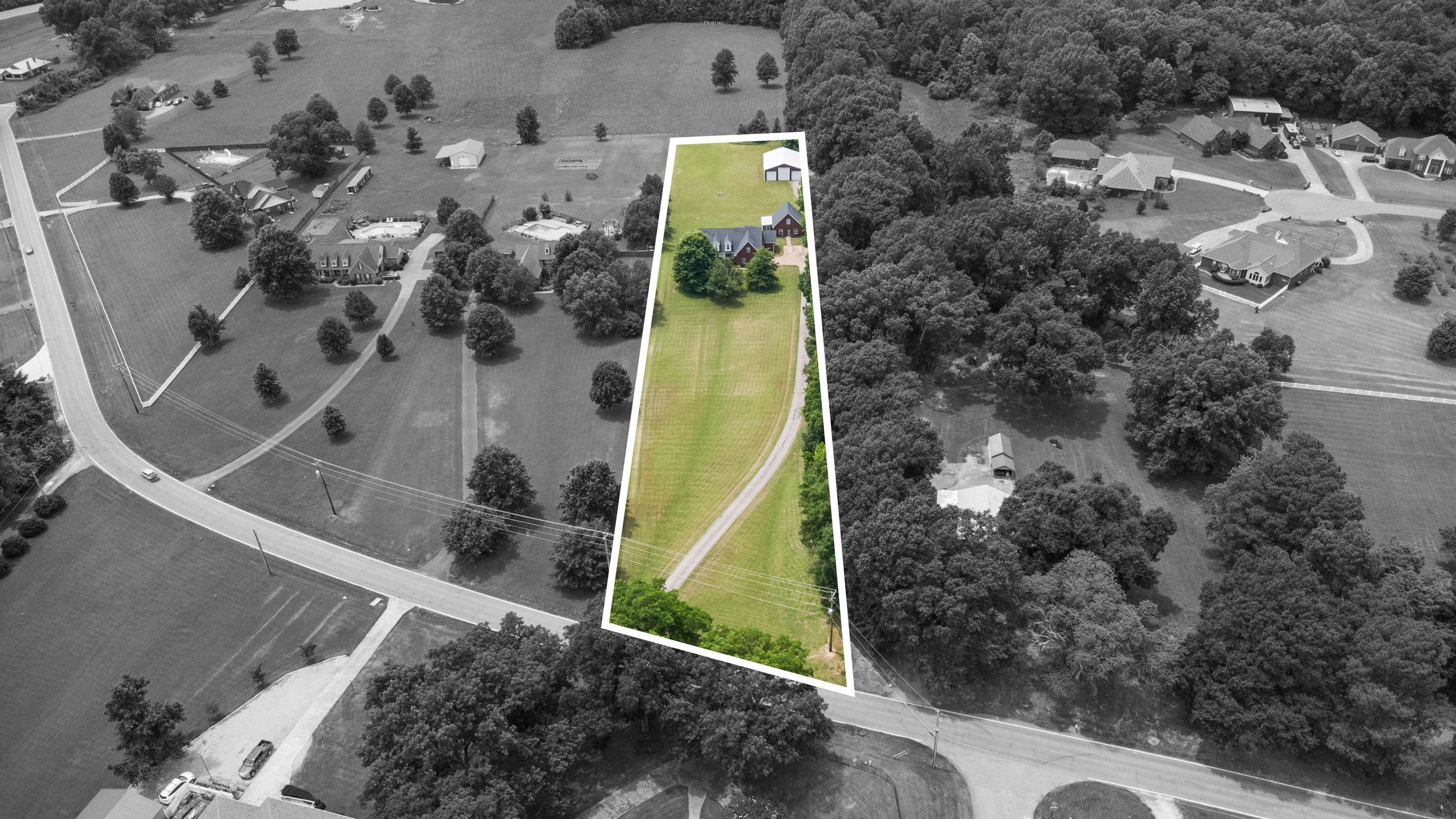 7757 Brunswick Road Millington, TN 38053 - Photo 38 of 40 Expansive green lot featuring a long private driveway, a main residence, and an auxiliary structure