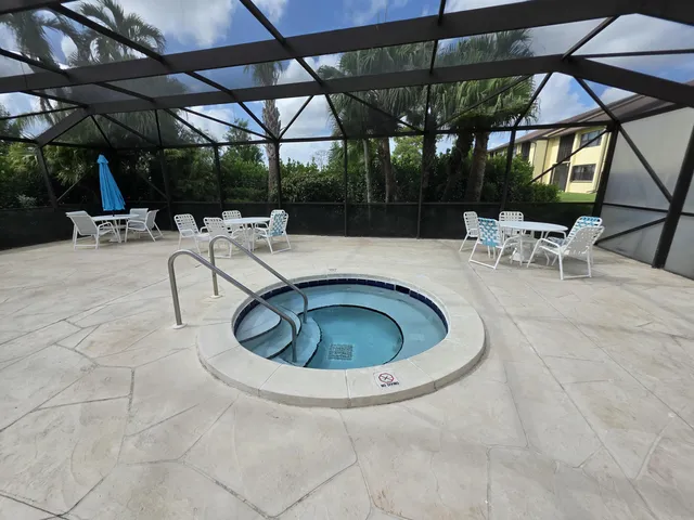 a view of a swimming pool with a patio