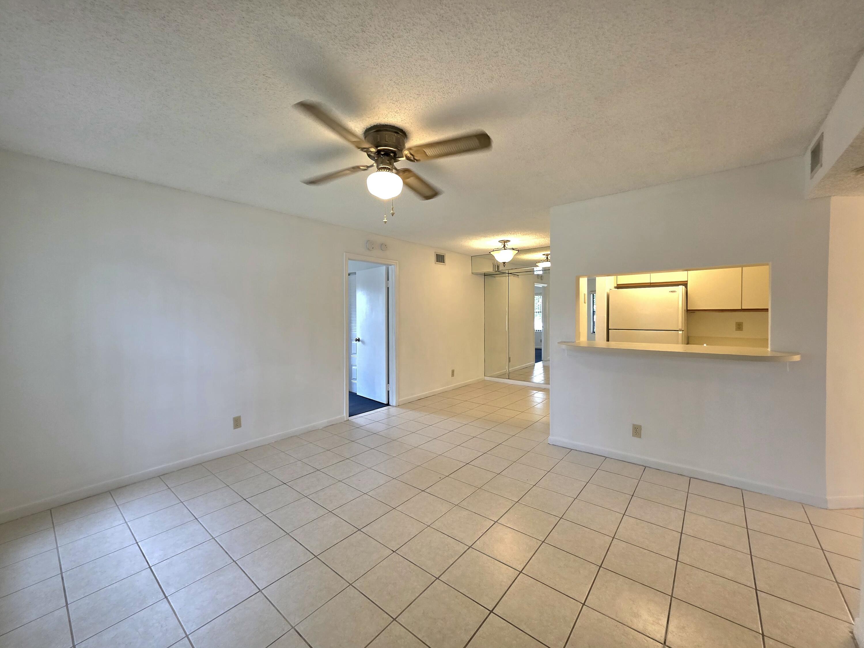 4709 Lucerne Lakes Boulevard East, Unit 101 Lake Worth, FL 33467 - Photo 3 of 18 Living Room