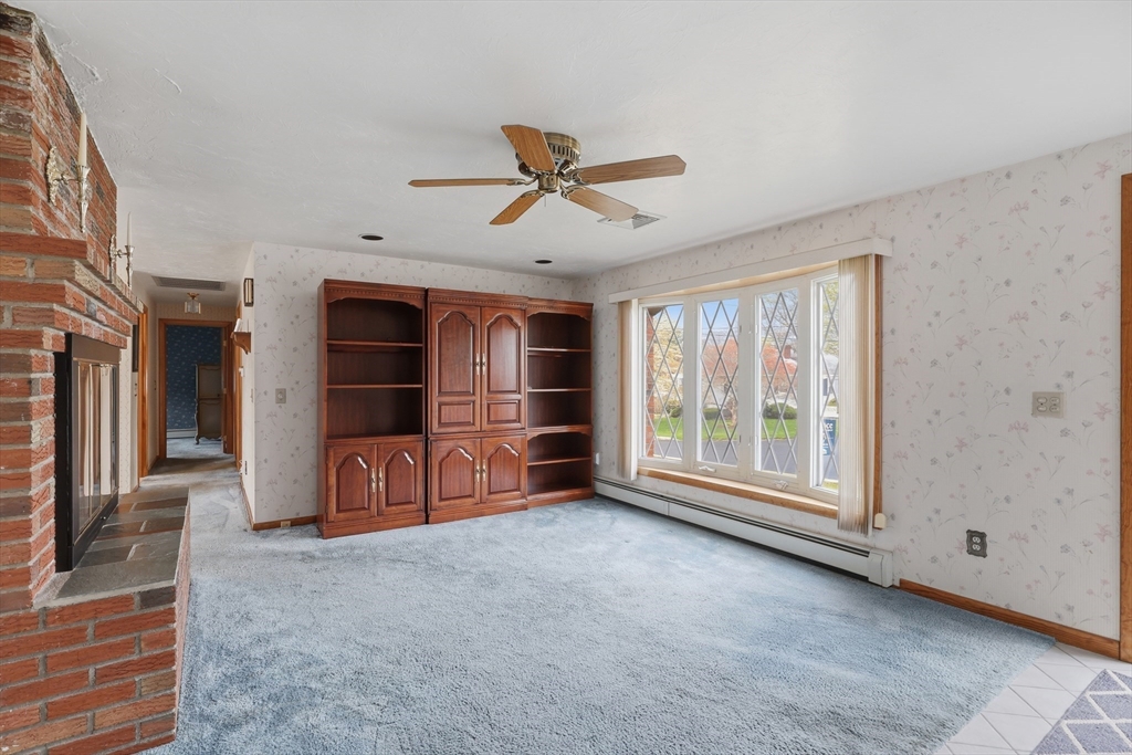 10 Deluca Road Milford, MA 01757 - Photo 8 of 37 a view of a livingroom with furniture and a ceiling fan