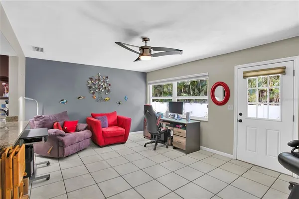 a bedroom with furniture and a window