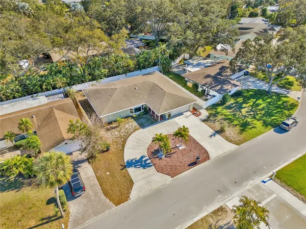 an aerial view of a house with a swimming pool