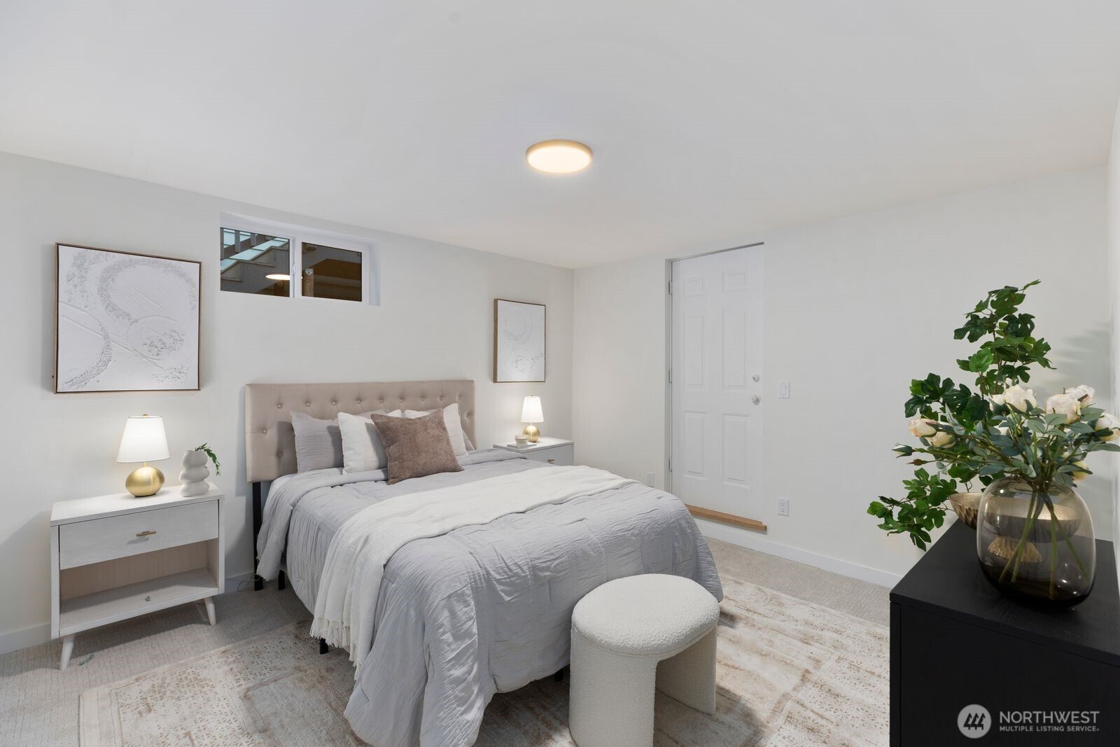 8216 Interlake Avenue North Seattle, WA 98103 - Photo 21 of 36 a bedroom with a bed and a potted plant