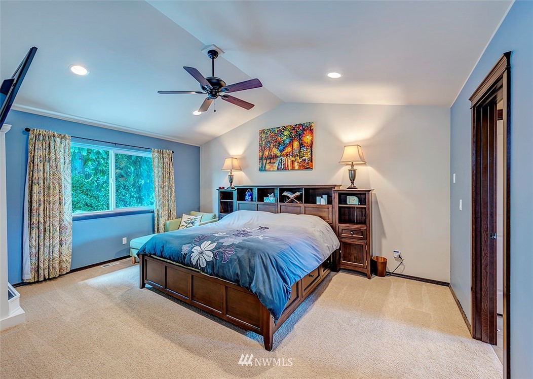 3423 189th Place Southeast Bothell, WA 98012 - Photo 14 of 23 a bed sitting in a room next to a window