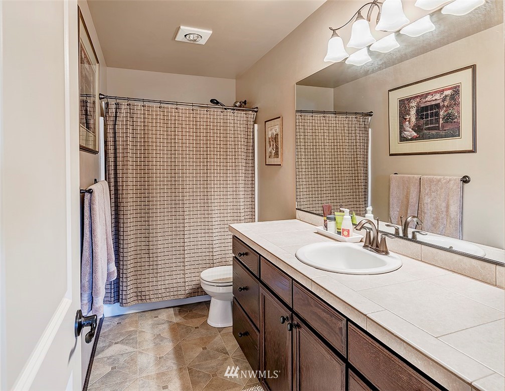 3423 189th Place Southeast Bothell, WA 98012 - Photo 22 of 23 a bathroom with a sink toilet and shower