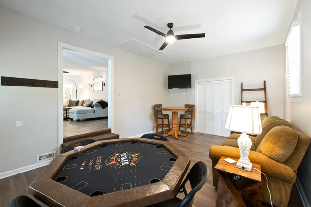 a room with furniture and a ceiling fan