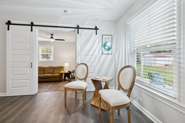 a living room with furniture and a window