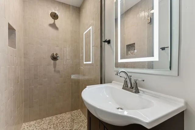 a bathroom with a sink and a mirror