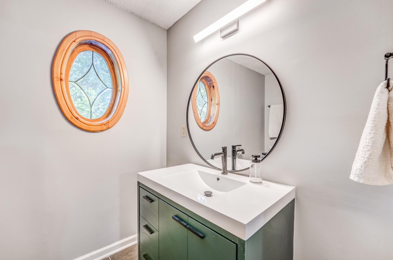 8651 Baylor Road Bartlett, TN 38002 - Photo 14 of 29 a bathroom with a sink and a mirror