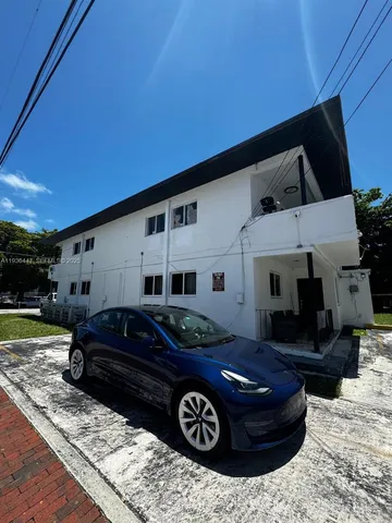 a front view of a house with parking space