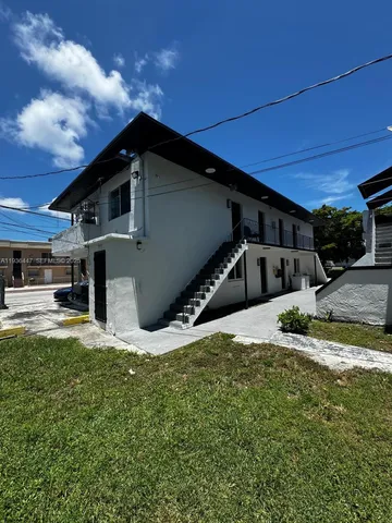a view of a backyard of the house