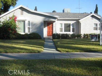 3583 Oakwood Place Riverside, CA 92506 - Photo 1 of 1 a front view of a house with a yard