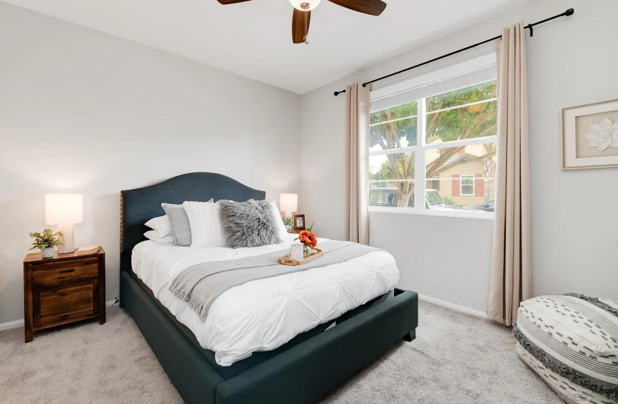 1767 Ragtime Way Oceanside, CA 92054 - Photo 14 of 28 a bedroom with a bed lamp and a large window