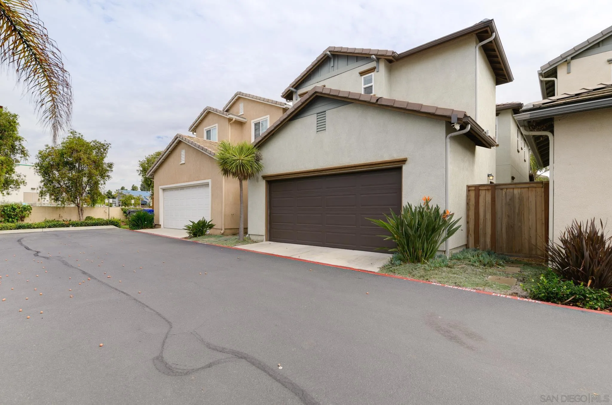 1767 Ragtime Way Oceanside, CA 92054 - Photo 25 of 28 a view of a house with a yard and garage