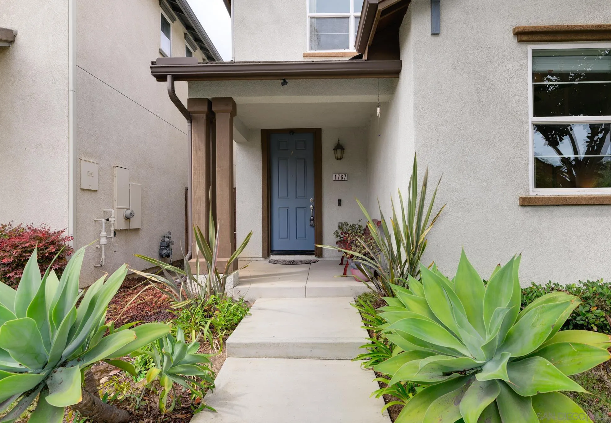 1767 Ragtime Way Oceanside, CA 92054 - Photo 26 of 28 a front view of a house with entryway