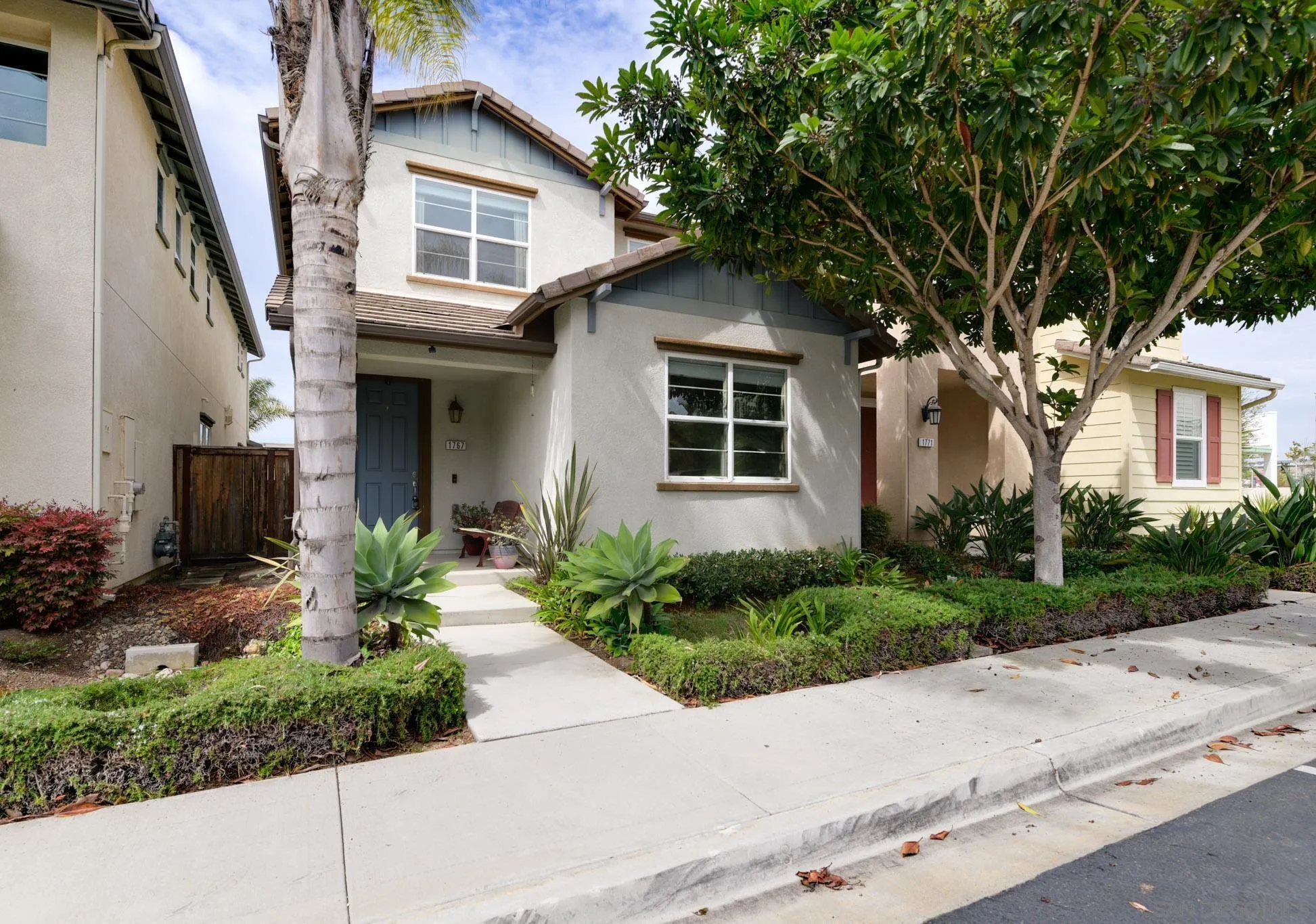 1767 Ragtime Way Oceanside, CA 92054 - Photo 27 of 28 a front view of a house with garden