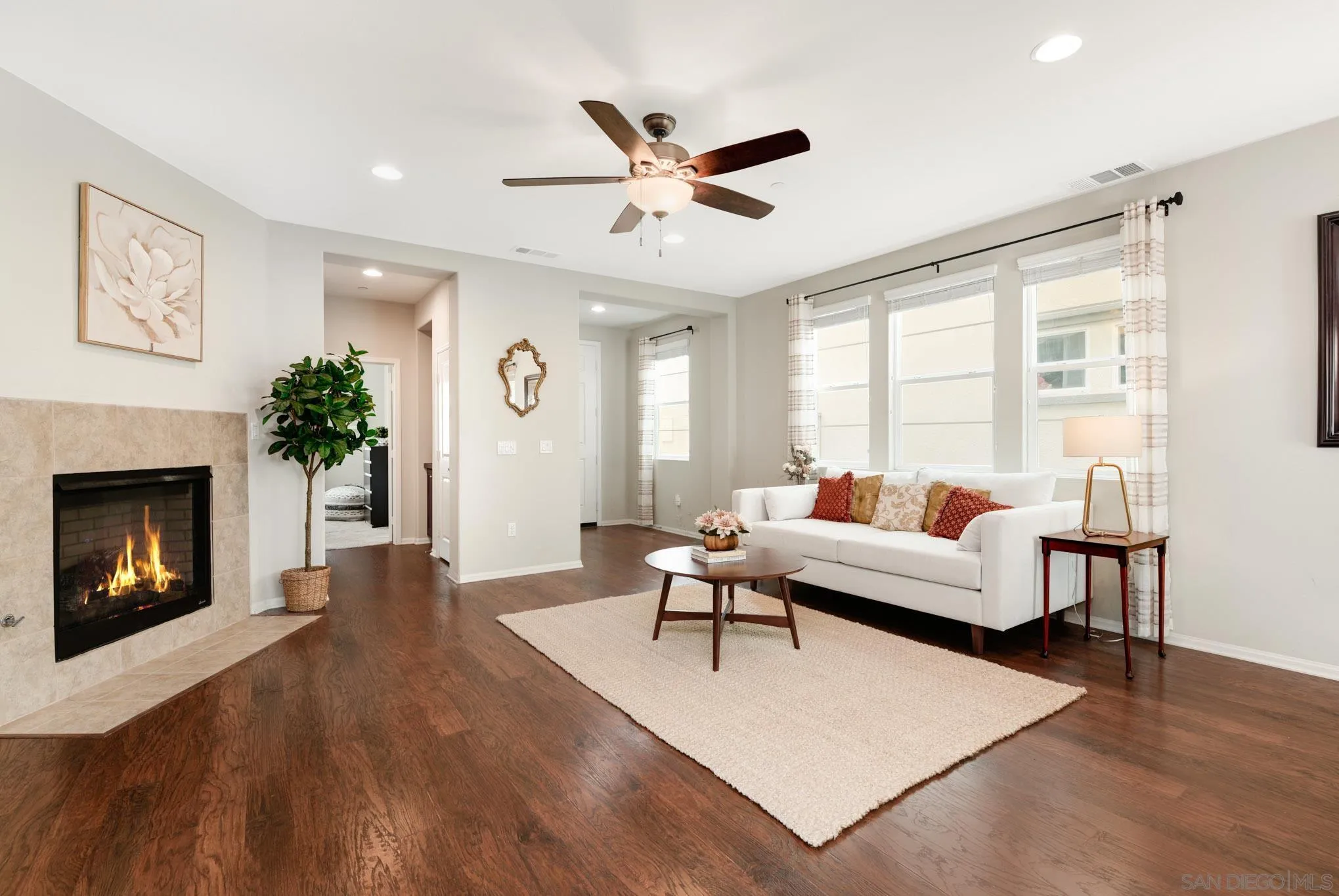1767 Ragtime Way Oceanside, CA 92054 - Photo 4 of 28 a living room with furniture and a fireplace