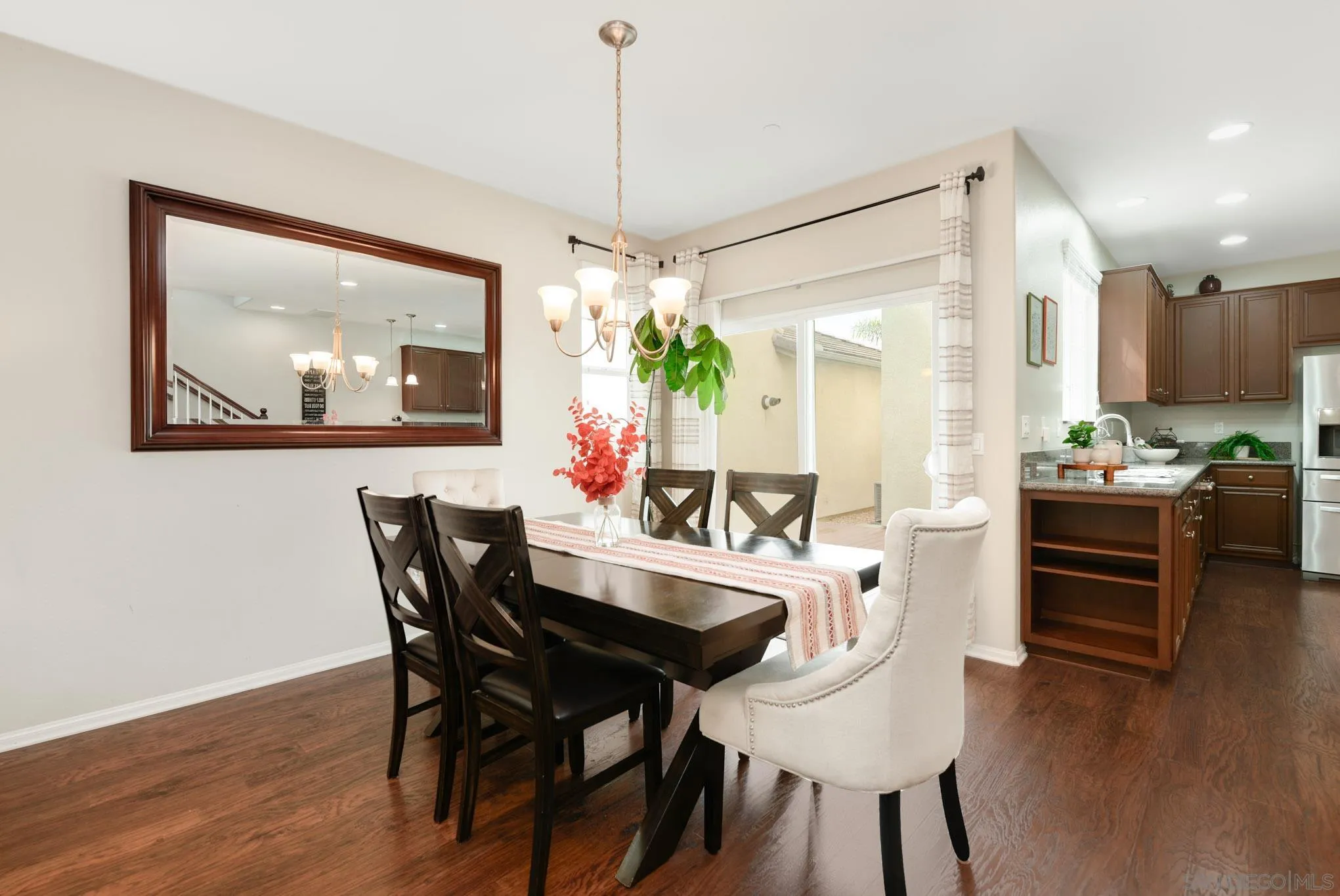 1767 Ragtime Way Oceanside, CA 92054 - Photo 5 of 28 a dining room with furniture and wooden floor