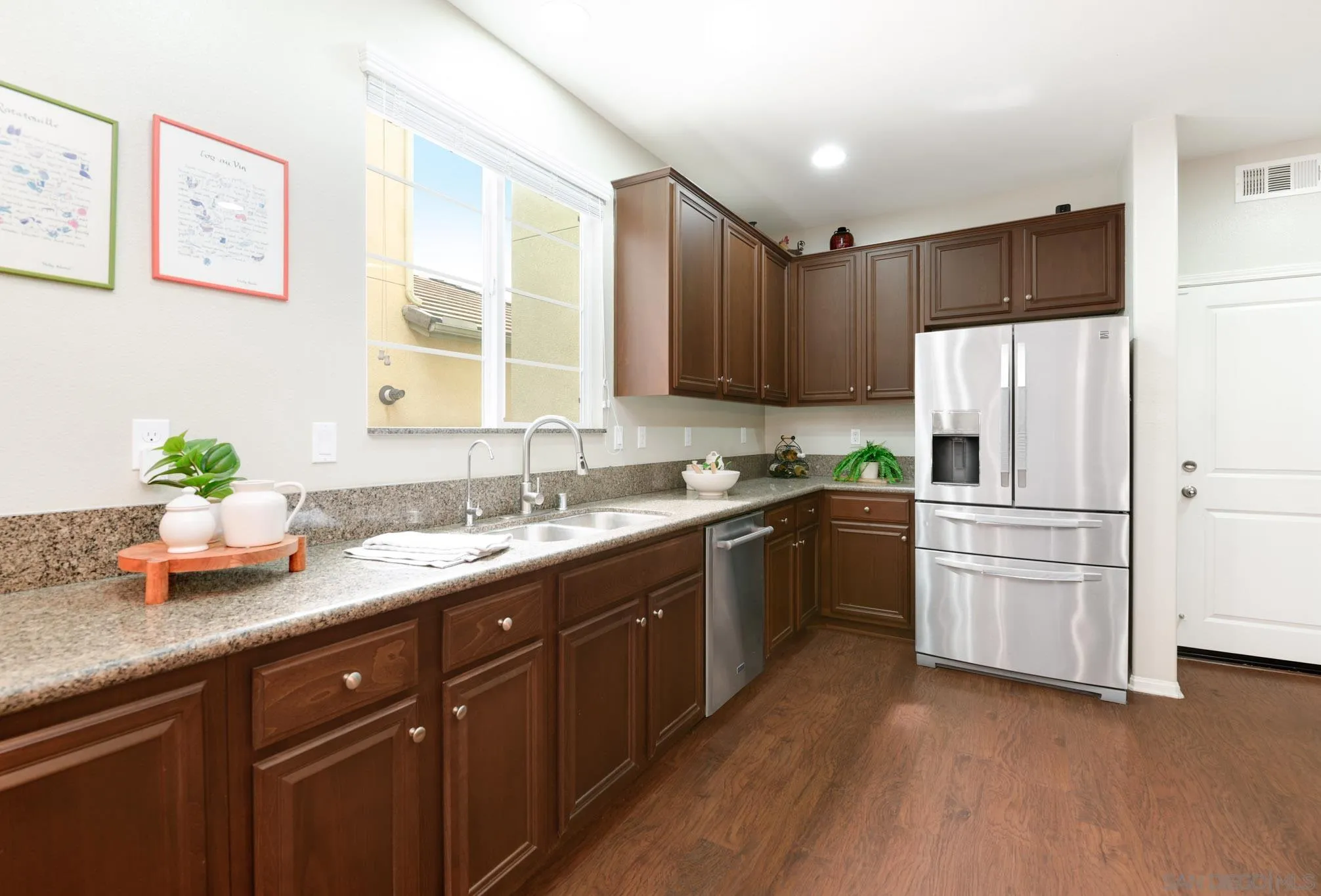 1767 Ragtime Way Oceanside, CA 92054 - Photo 9 of 28 a kitchen with a sink stove and refrigerator