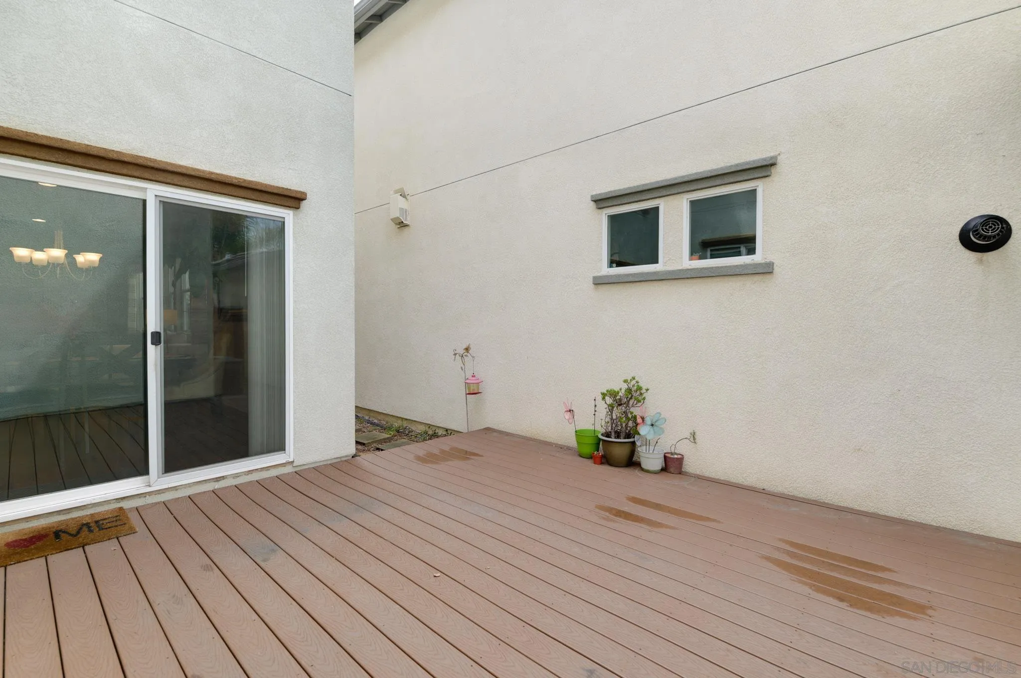1767 Ragtime Way Oceanside, CA 92054 - Photo 10 of 28 a bedroom with a bed and wooden floor