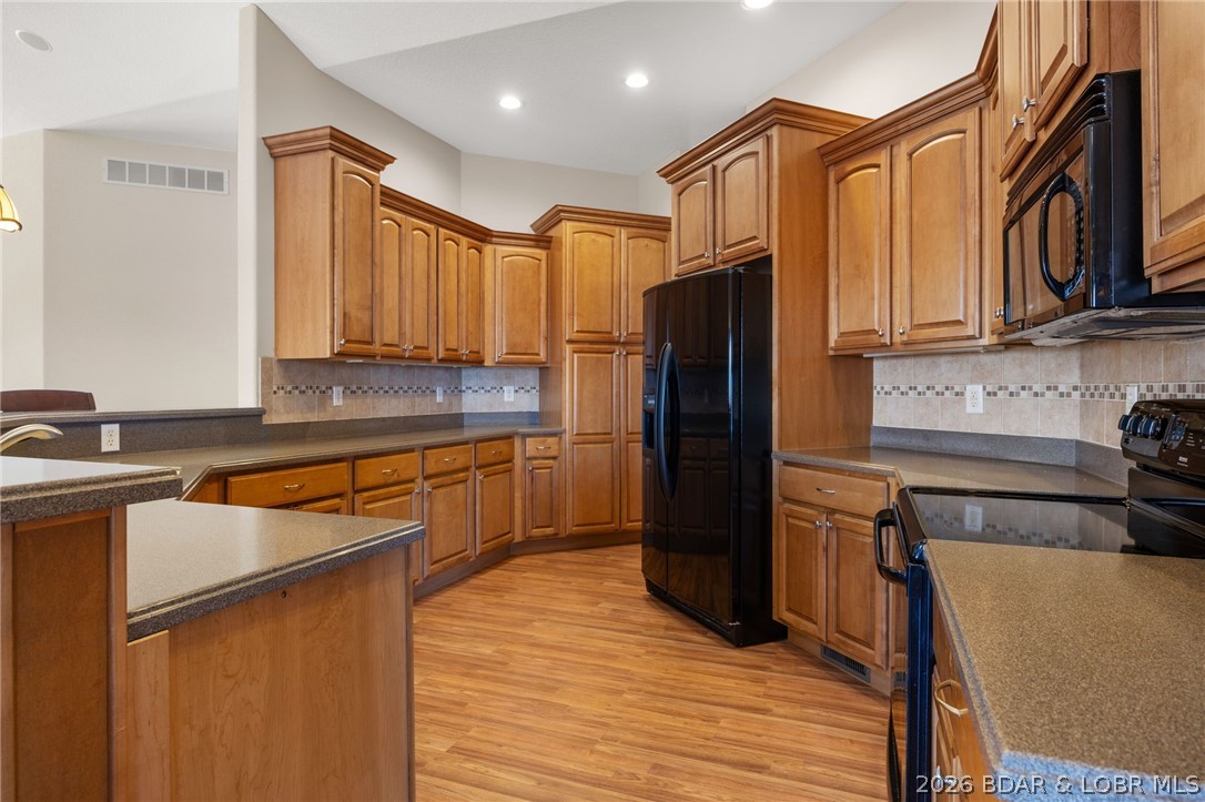 1386 Nichols Road Osage Beach, MO 65065 - Photo 13 of 62 Plenty of cabinets to store all of your kitchen su