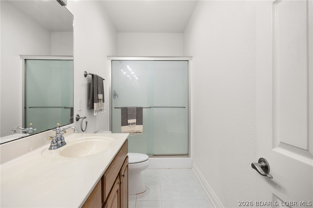 1386 Nichols Road Osage Beach, MO 65065 - Photo 30 of 62 Bathroom #2 located on the main level between the