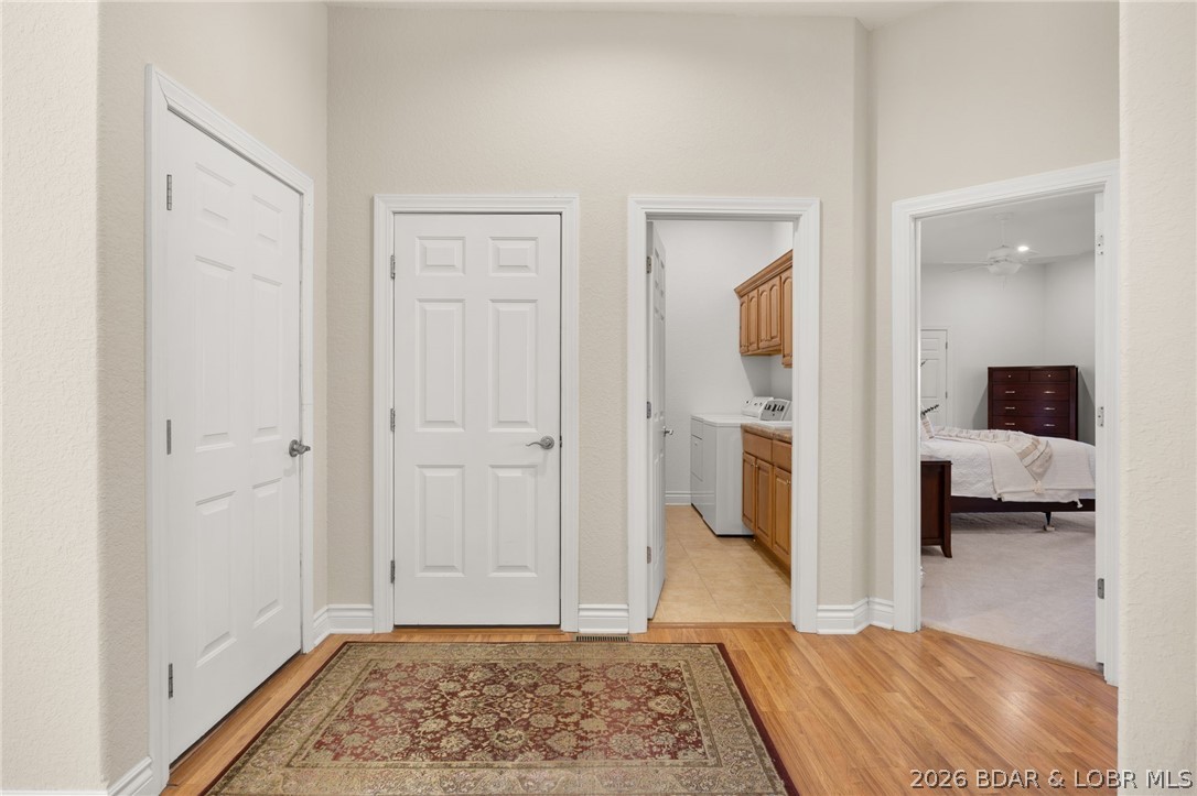 1386 Nichols Road Osage Beach, MO 65065 - Photo 33 of 62 Hallway connecting the foyer, garage, laundry room