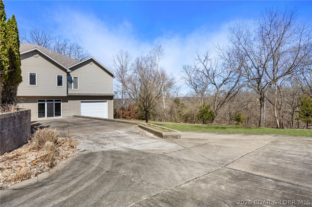 1386 Nichols Road Osage Beach, MO 65065 - Photo 45 of 62 Poured concrete driveway to the walk out lower lev
