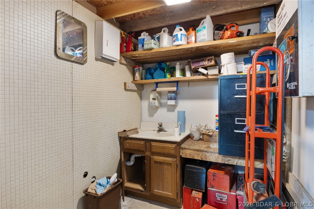 1386 Nichols Road Osage Beach, MO 65065 - Photo 52 of 62 Bathroom located in the back corner of the large s