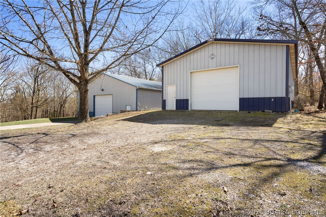 1386 Nichols Road Osage Beach, MO 65065 - Photo 53 of 62 Small shop with dirt driveway to the overhead door