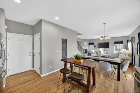 a view of a dining room with furniture and window