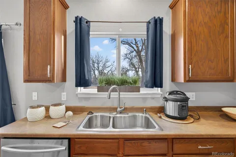 a kitchen with a sink and a window