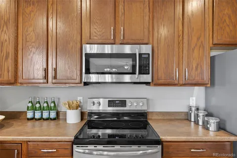 a kitchen with a stove and cabinets