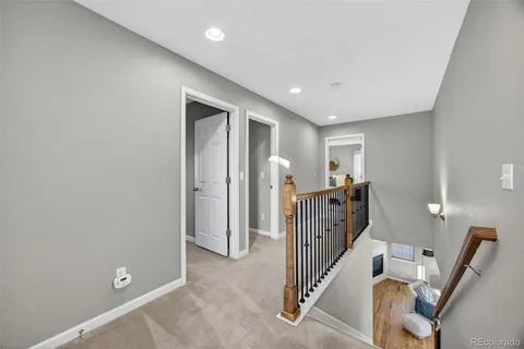 a view of a livingroom with stairs and furniture