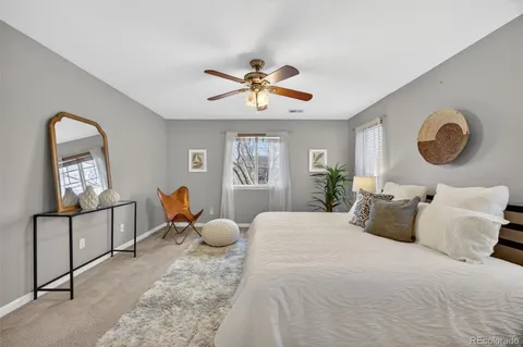a bedroom with furniture and a window