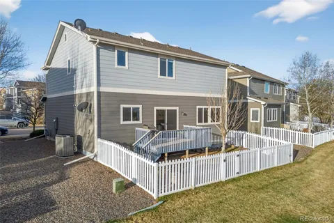 a front view of a house with iron fence