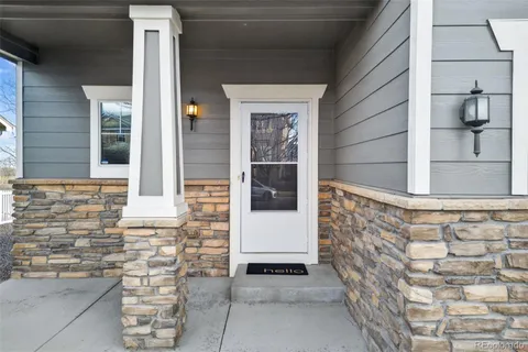 a brick building with a door and a window