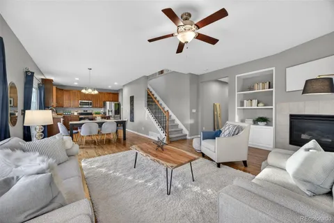 a living room with furniture and kitchen view