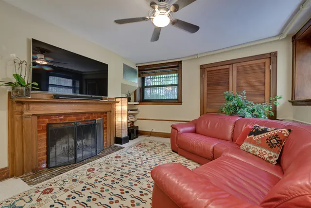 a living room with furniture fireplace and flat screen tv