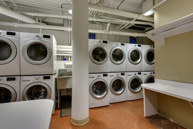 a utility room with dryer washer and dryer