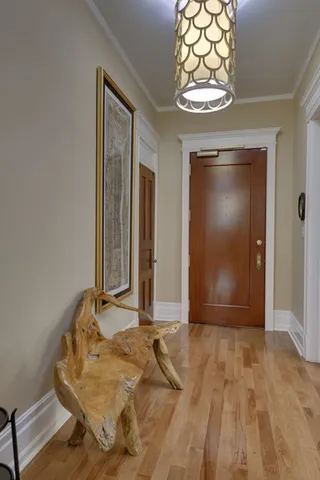 a view of a room with wooden floor and window